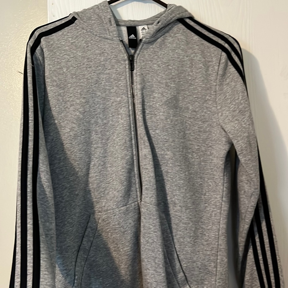 Gray Adidas zip up jacket, no strings. Good condition, size M.